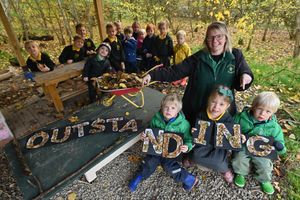 Little Acorns Pre-school is celebrating its 'Outstanding' Ofsted report. Pre-school lead April Jones with Theodore, Scarlett, and Rupert, and other children