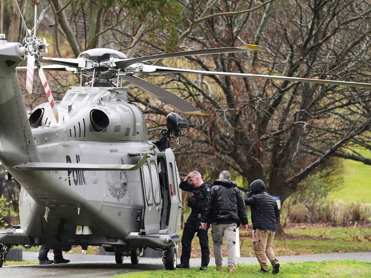 Suspect identified as Australia police shooting manhunt continues