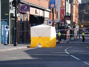 Forensic officers at the scene in Brixton Road after a man died from stab injuries