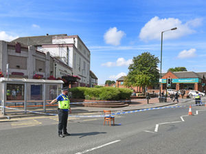 Police outside the Malthouse in New Road after Mr Powney's death in July
