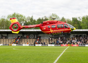 There was a rather dramatic scene at the end of Hednesford's play-off triumph as the air ambulance landed on the pitch at the end of the game to airlift a supporter to hospital after they suffered a heart attack during the celebrations (Picture: Jim Wall)