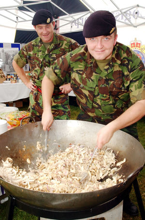 Day at wok... Staff Sergeant Gary Hatton (left) from Donnington and Warrant Officer Simon Jarman from Shrewsbury of the Royal Logistic Corps demonstrate their cooking skills.