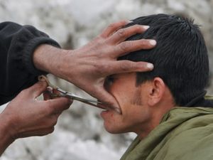 Supporting image for story: Taliban morality police arrest men for wrong hairstyle or skipping mosque – UN