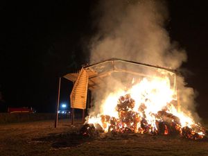 Supporting image for story: Flames rip through 70 tons of hay in barn fire