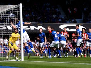Brentford forward Kevin Schade, right, heads home the only goal of the game