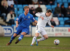 Chris Churchman of Stockport County and Shaun Whalley of AFC Telford United