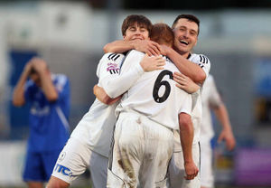 Mike Grogan of AFC Telford United celebrates his goal with Charlie Barnett and Matty McGinn of AFC Telford United