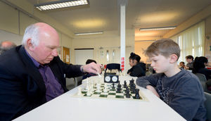 Mike Hoare, a county player for Staffordshire, and Norton Canes Chess Club founder kicks off the competition with eleven year old Jude Haycock
