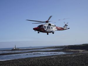 An HM coastguard helicopter (Owen Humphreys/PA)