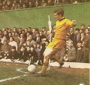 Terry Wharton taking a corner in front of the North Bank