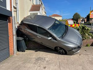 The car reversed onto a wall in Bourne Street, Coseley. Photo: WMFSDudley