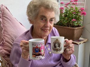 Rita Moir with her Silver Jubilee Mug and her latest, Diamond Jubilee mug.