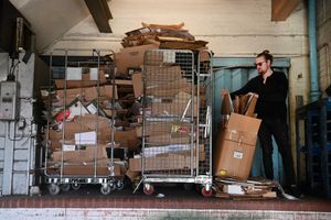 Edward Swannie who runs Plaza Mall with some of the build up of cardboard at the rear of the premises.