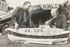 Dan Wright (right) of the Albrighton Scout Unit displayed a model of a Solent class lifeboat, the City of Birmingham, outside his house, alongside an inshore lifeboat, both of which were to be displayed at the Albrighton Scout and Guides' summer fair. Pictured left is Malcolm Pate, chairman of the parents supporters association, June 16, 1977.