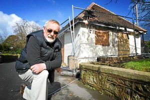 March 2014: Ex-Mayor Frank Burns takes a look at the fire damage to the pavilion at Bowring Park