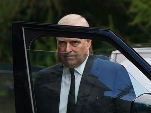 Supporting image for story: Andrew not in military uniform except for lying in state vigil