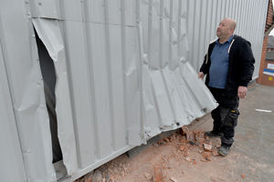 Gil Freitas from Crown Roofing inspecting the damage