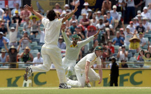 Australia's George Bailey (right) celebrates taking the catch of England's James Anderson to win the match and the Ashes