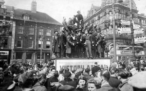 A photograph of Queen Square in Wolverhampton in May, 1945, when jubilant townsfolk celebrated VE Day, with some even climbing aboard the statue of Prince Albert mounted on his horse  