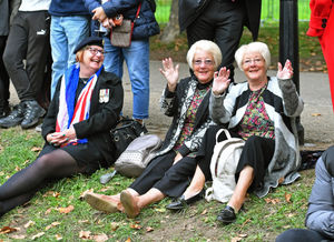 Women celebrating the Queen's reign in Green Park.
