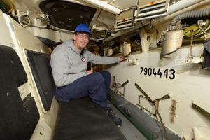 Ian Keogh sits in a Russian Armoured Carrier 
