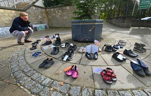 Councillor George Hollyhead viewing the shoes on display.