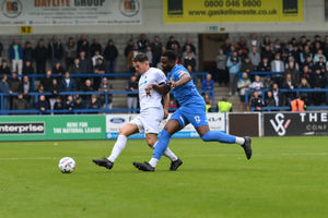 Alex Fletcher battles for possession against Evesham United (Picture: Kieren Griffin Photography)