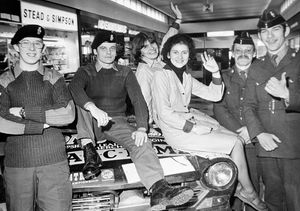 March 1978 - the caption pasted on the back is: 'Mrs Teresa Taylor, left (maiden name Teresa Dean) and Miss Karen Buttery, both of Dawley, with soldiers of the 52 Company RAOC (Royal Army Ordnance Corps) volunteers who have a recruiting drive at Telford Centre. Here with the RAOC rally car are, from left, Lance Corporal Nigel Trew of Wrockwardine Wood, Private Terry Harrison of Donnington, Corporal Terry Lewis of Trench, and Private Gavin Sherry of Donnington.'