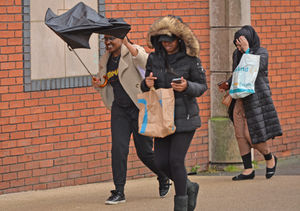 Coping with Storm Dudley's winds in Gallery Square, Walsall