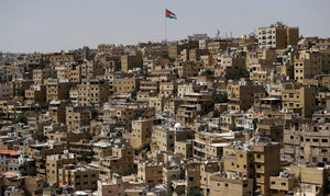 A big Jordanian flag flutters in front of Amman's Jabal al-Qala district. (Photo by AHMAD GHARABLI/AFP via Getty Images)          