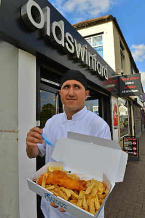 Owner John Ioannou outside the Oldswinford chippy