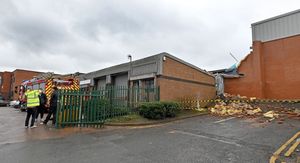 Fire crews at Shell Corner Business Park, Halesowen, after a wall collapsed onto another industrial unit