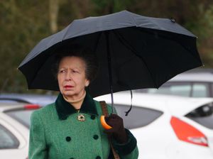 The Princess Royal experienced heavy rain in Lydney (Ben Birchall/PA)