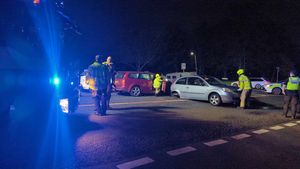 Emergency service personnel at the scene of the crash