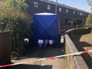 A police forensics tent at the scene