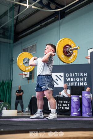 Adaptive athlete Oliver Malone performing a clean and jerk