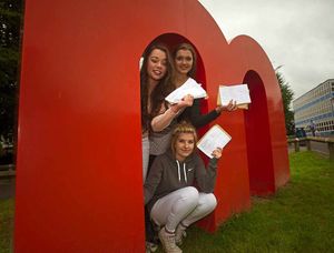 Lucy Burn, Isobel Earnshaw, and Emily Shail celebrate their results at The Marches School in Oswestry