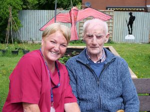 Chirk Court activities coordinator Nicola in the sensory garden with resident Les who is a keen gardener.