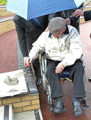 Harry Williams lays the last brick