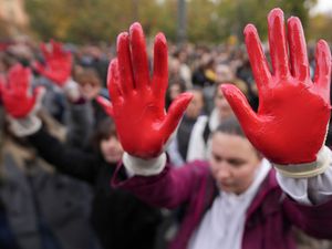 Protesters with red paint on their hands to symbolise blood demand arrests after the fatal collapse of a station roof in the northern Serbian city of Novi Sad