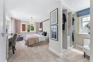 The main bedroom has a dressing room and en-suite