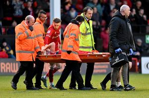 Walsall's Conor Wilkinson is stretchered off