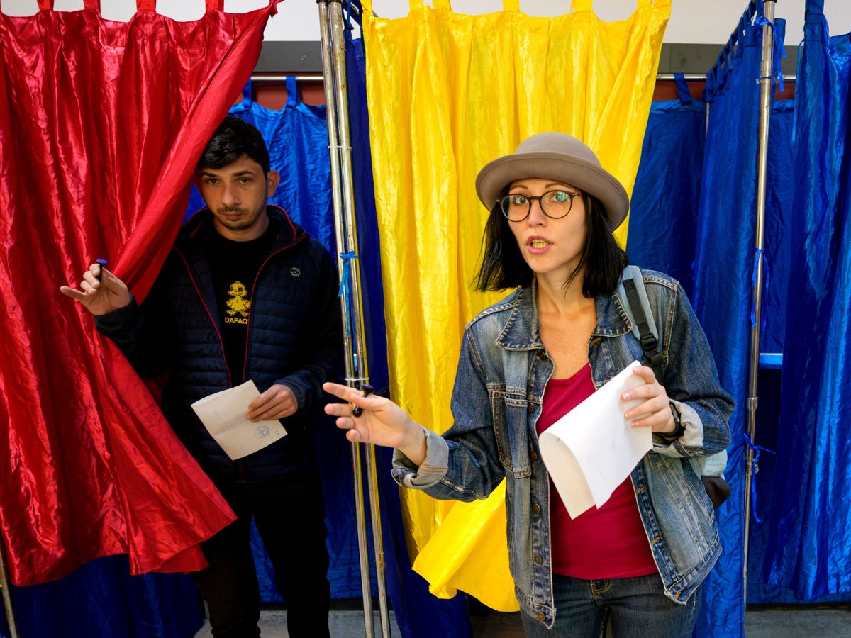 Romanians voting in crucial election which could decide direction of country