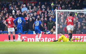 Burgoyne saving a penalty during an FA Cup tie at Chelsea