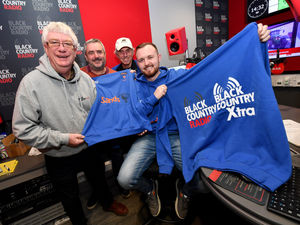 Supporting image for story: Charity makes hoodie donation to father support football team