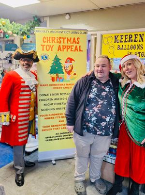 Lions President Debra Coburn and Town Crier Adrian Basford with Keeran Hart owner of Keeran's Kardz in Brewery Street. One of the Lions collection points for the Toy Appeal. 