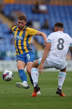 Matthew Pennington of Shrewsbury Town and Josh Brownhill of Burnley (AMA)