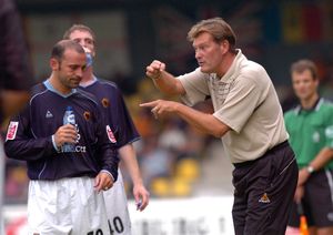 Colin Cameron listens as Glenn Hoddle makes hand signals