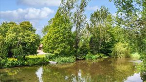 A lake to the front of the property that boasts 3.4 acres of land. Picture: Rightmove/Knight Frank.