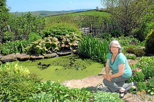 Polly Smith by her pond at Crossways